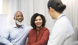 heart disease men and women - couple talking to doctor