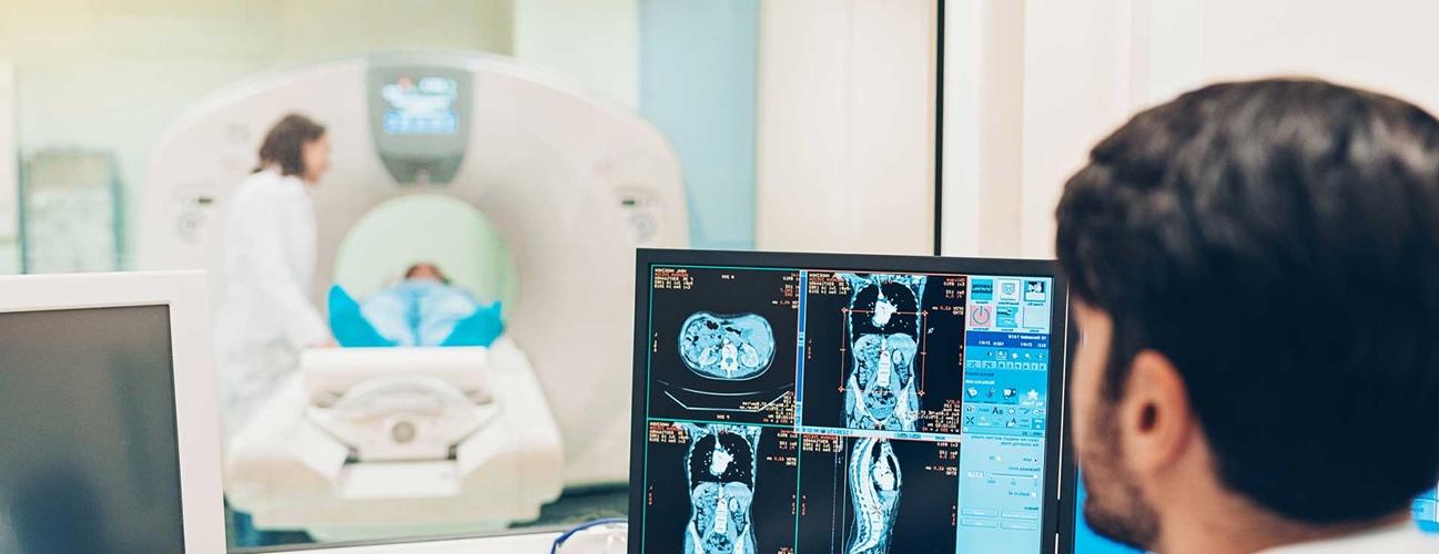 Doctors using a MRI machine to scan patient